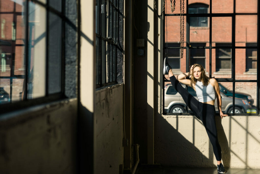 Dancer stretches in Building