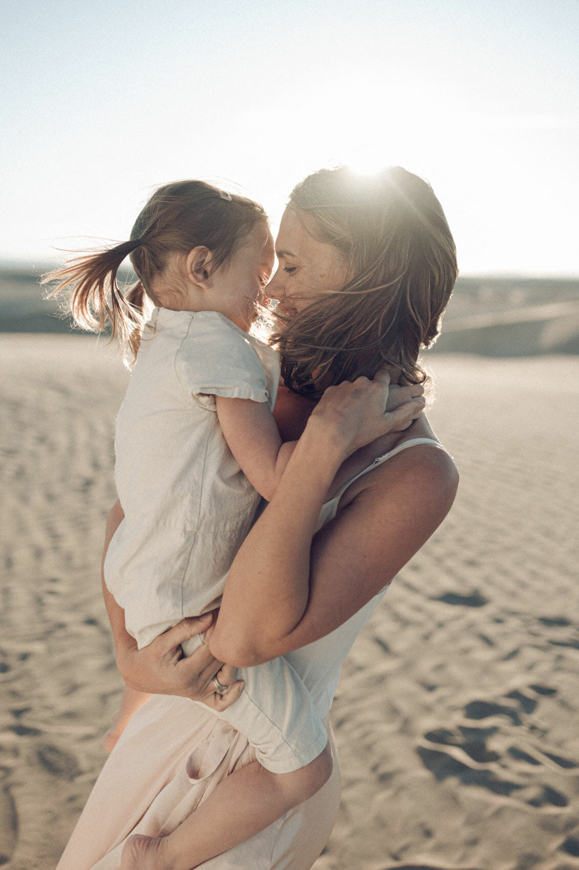 Mother and child on a sand dune
