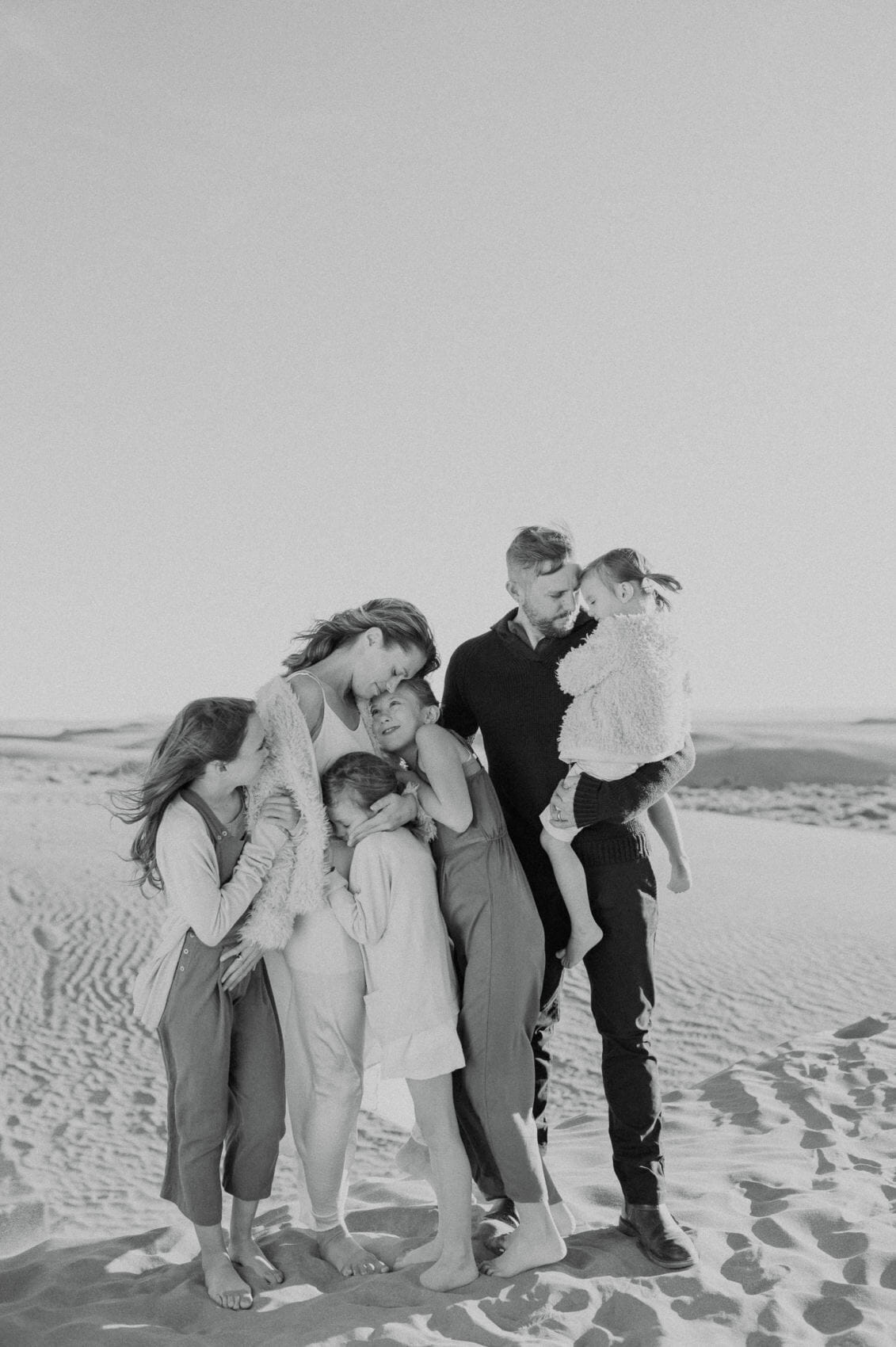 family on a sand dune