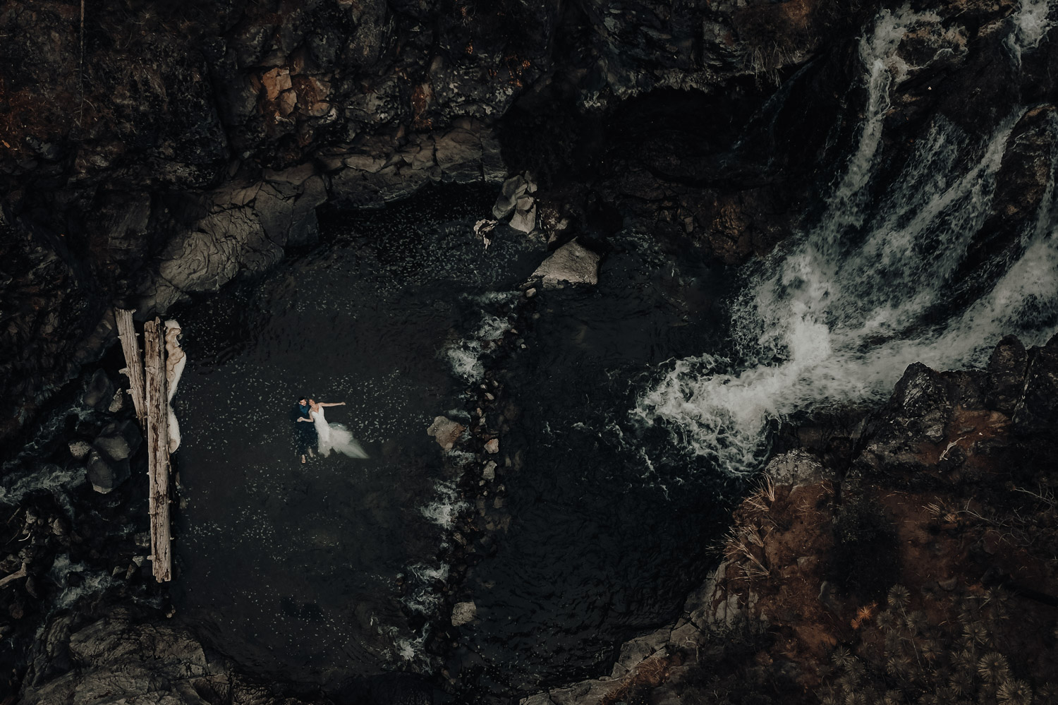 wedding couple in the water from above