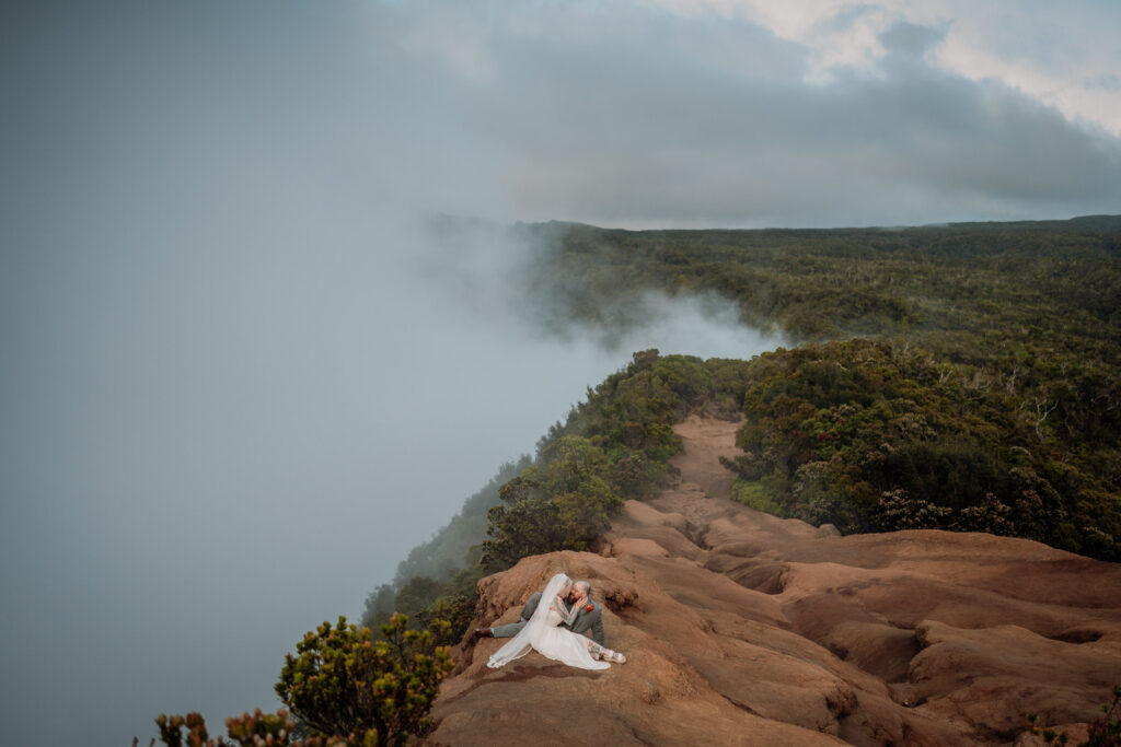 a wedding couple have a moment during their Kalalau portrait session