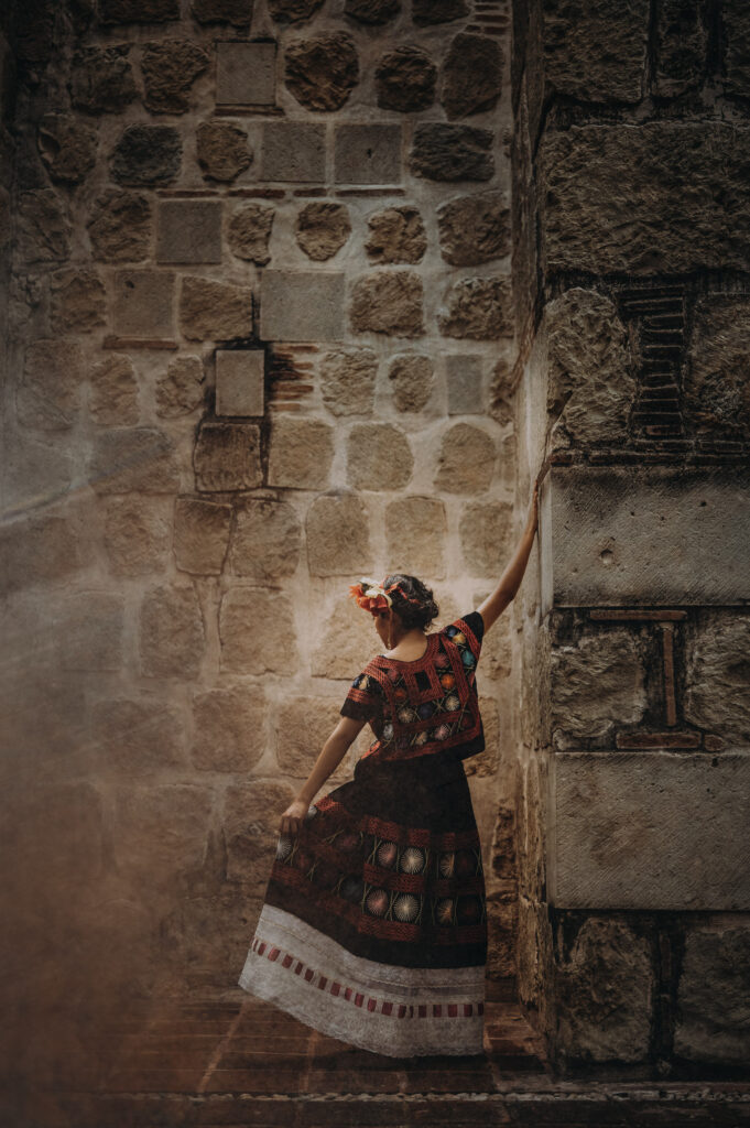 A young woman leaning on a wall in Mexico