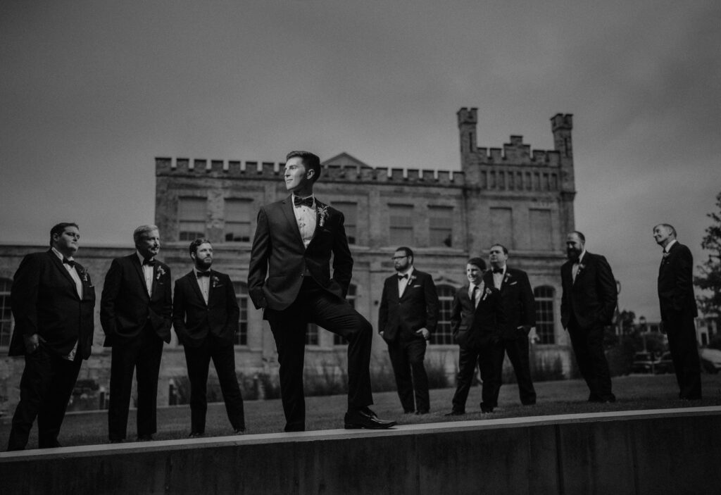 a groom and his wedding party at pabst brewery