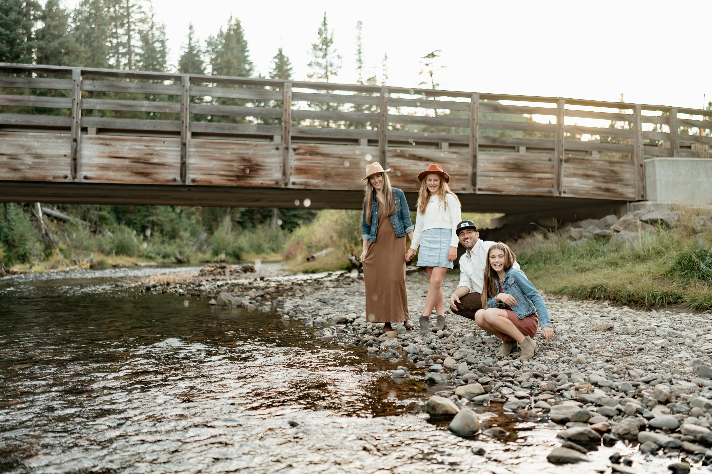 a family near the river during their family photo session